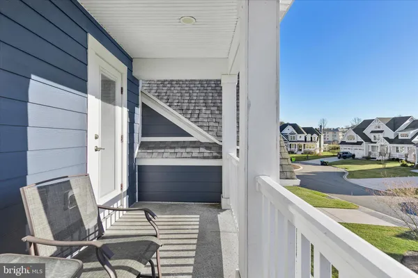 a view of a swimming pool with an outdoor space and seating area