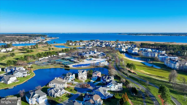 a living room with furniture fireplace and wooden floor