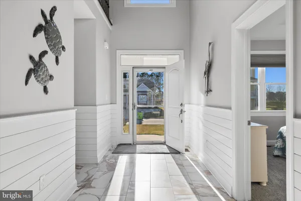 a kitchen with stainless steel appliances white cabinets and a granite counter tops