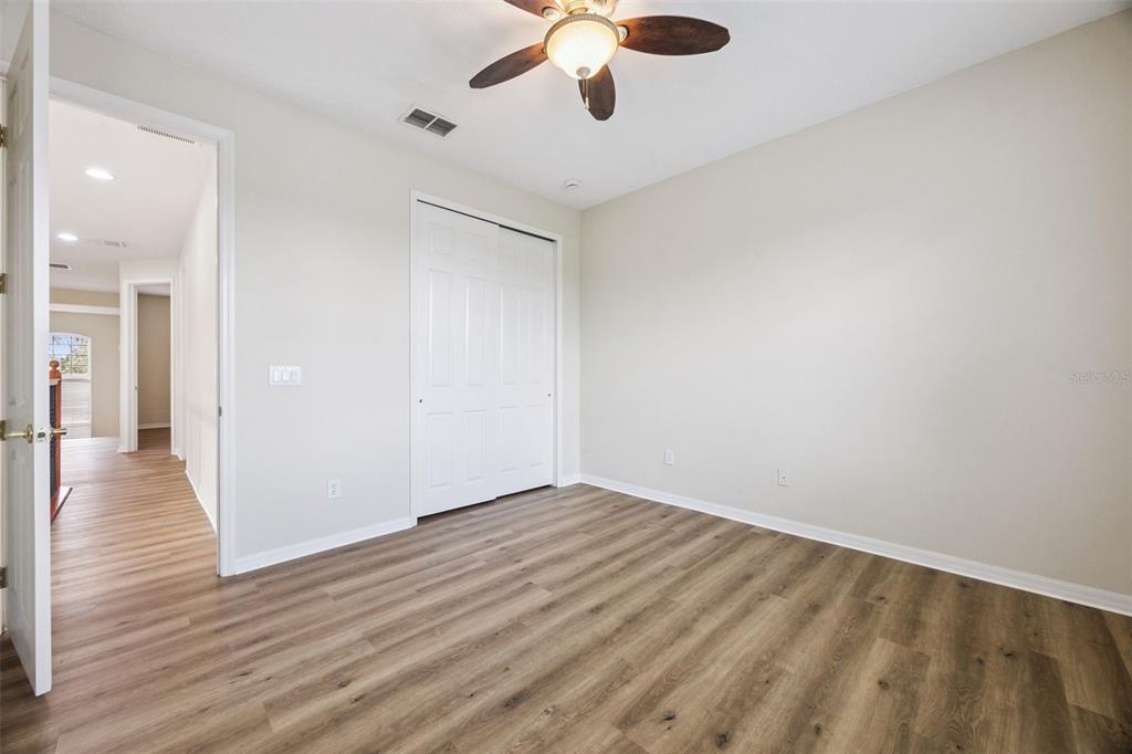 551 Terrace Spring Drive Orlando, FL 32828 - Photo 26 of 41 wooden floor in an empty room with a window
