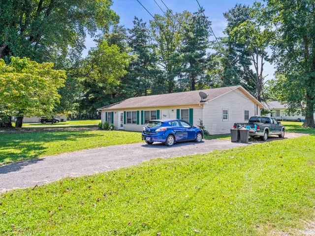 a view of a house with swimming pool and porch