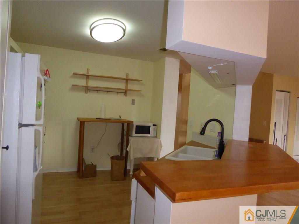 334 Edpas Road, Unit 334 New Brunswick, NJ 08901 - Photo 3 of 19 a picture of a room with a sink