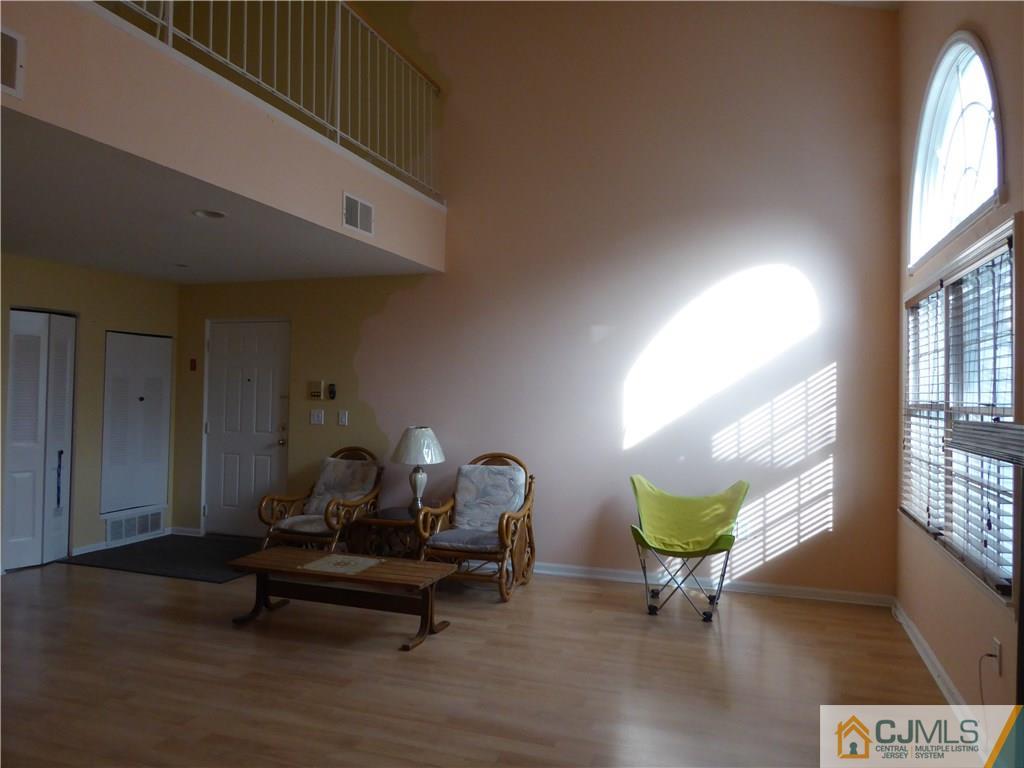 334 Edpas Road, Unit 334 New Brunswick, NJ 08901 - Photo 7 of 19 a living room with furniture a window and a potted plant