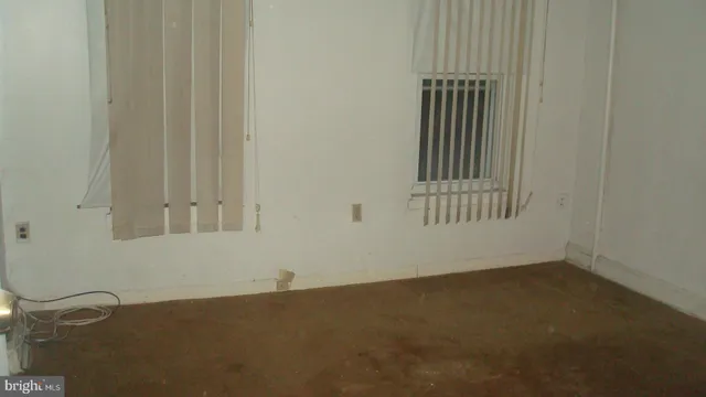 a view of a hallway with a white walls