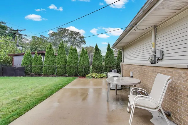 a view of a patio with a yard