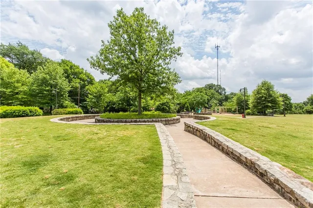 a view of a swimming pool and a yard