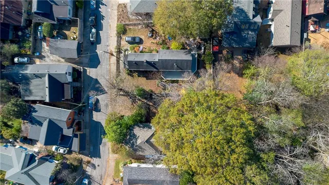 a aerial view of a house with a yard and garden
