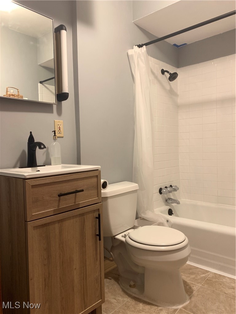 885 Reed Avenue Akron, OH 44306 - Photo 16 of 24 Full bathroom featuring shower / tub combo, tile patterned flooring, vanity, and toilet