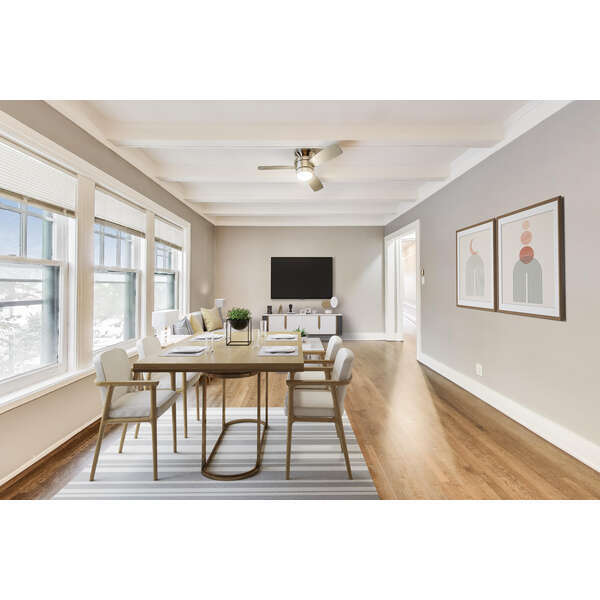 1615 East Hyde Park Boulevard, Unit 2 Chicago, IL 60615 - Photo 6 of 19 a living room with furniture a flat screen tv and a table