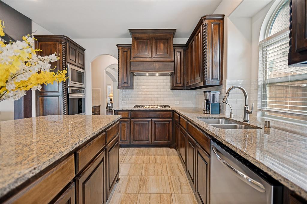 413 Frontier Court Midlothian, TX 76065 - Photo 10 of 26 Kitchen featuring a built-in oven, gas cooktop, stainless steel appliances, granite countertops, and tile flooring
