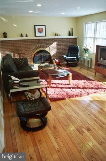 7644 Chancellor Way Springfield, VA 22153 - Photo 10 of 29 a living room with furniture and a fireplace