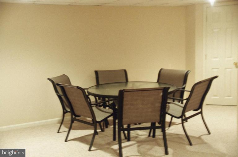 7644 Chancellor Way Springfield, VA 22153 - Photo 13 of 29 a view of a dining room with furniture and wooden floor
