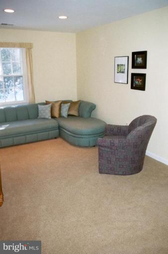 7644 Chancellor Way Springfield, VA 22153 - Photo 16 of 29 a living room with furniture and a couch