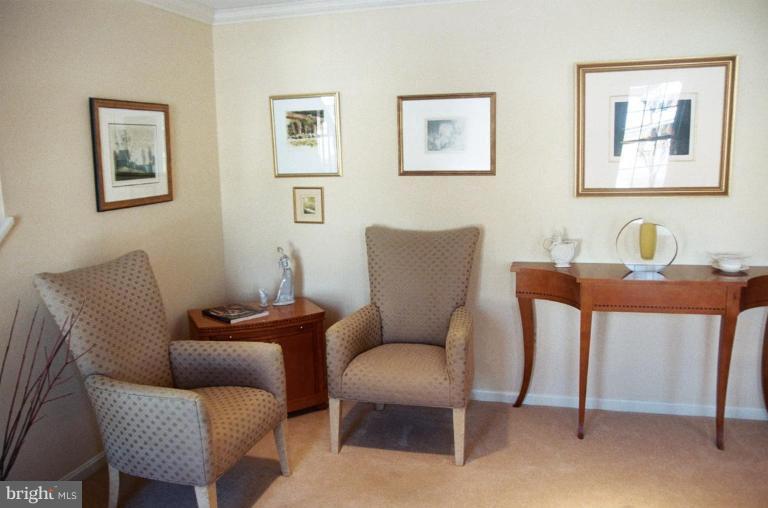 7644 Chancellor Way Springfield, VA 22153 - Photo 2 of 29 a work room with furniture and a chair
