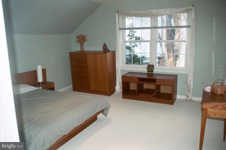 7644 Chancellor Way Springfield, VA 22153 - Photo 21 of 29 a bed room with a bed and a window