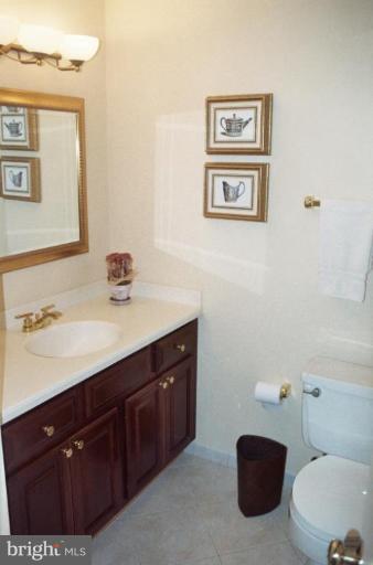 7644 Chancellor Way Springfield, VA 22153 - Photo 22 of 29 a bathroom with a sink and a mirror