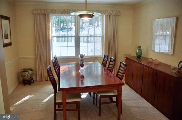 7644 Chancellor Way Springfield, VA 22153 - Photo 3 of 29 a view of a dining room with furniture window and outside view