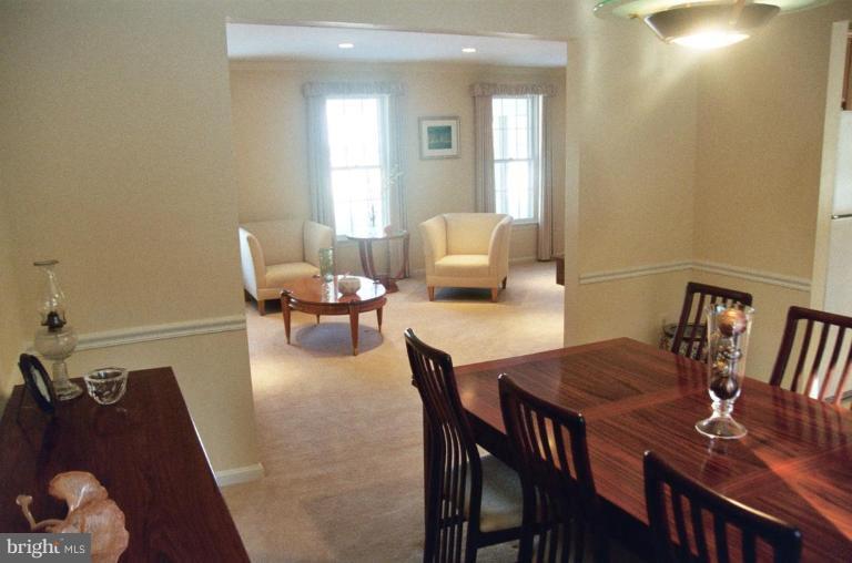 7644 Chancellor Way Springfield, VA 22153 - Photo 29 of 29 a living room with furniture and wooden floor