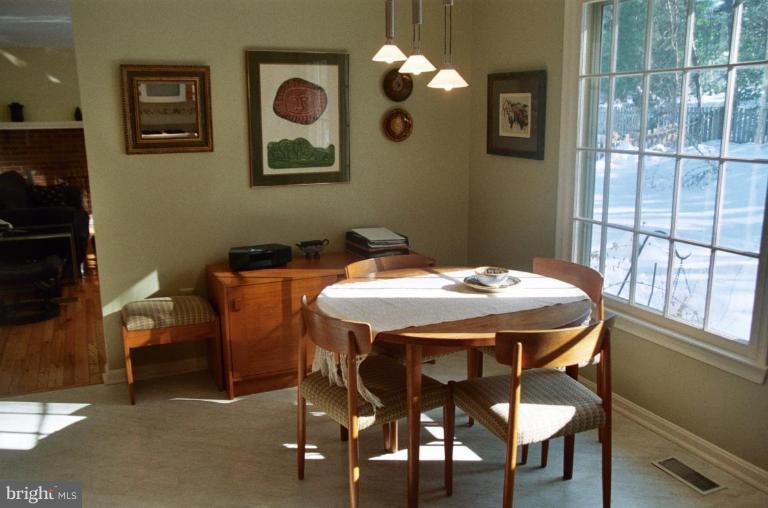 7644 Chancellor Way Springfield, VA 22153 - Photo 8 of 29 a dining room with furniture and window