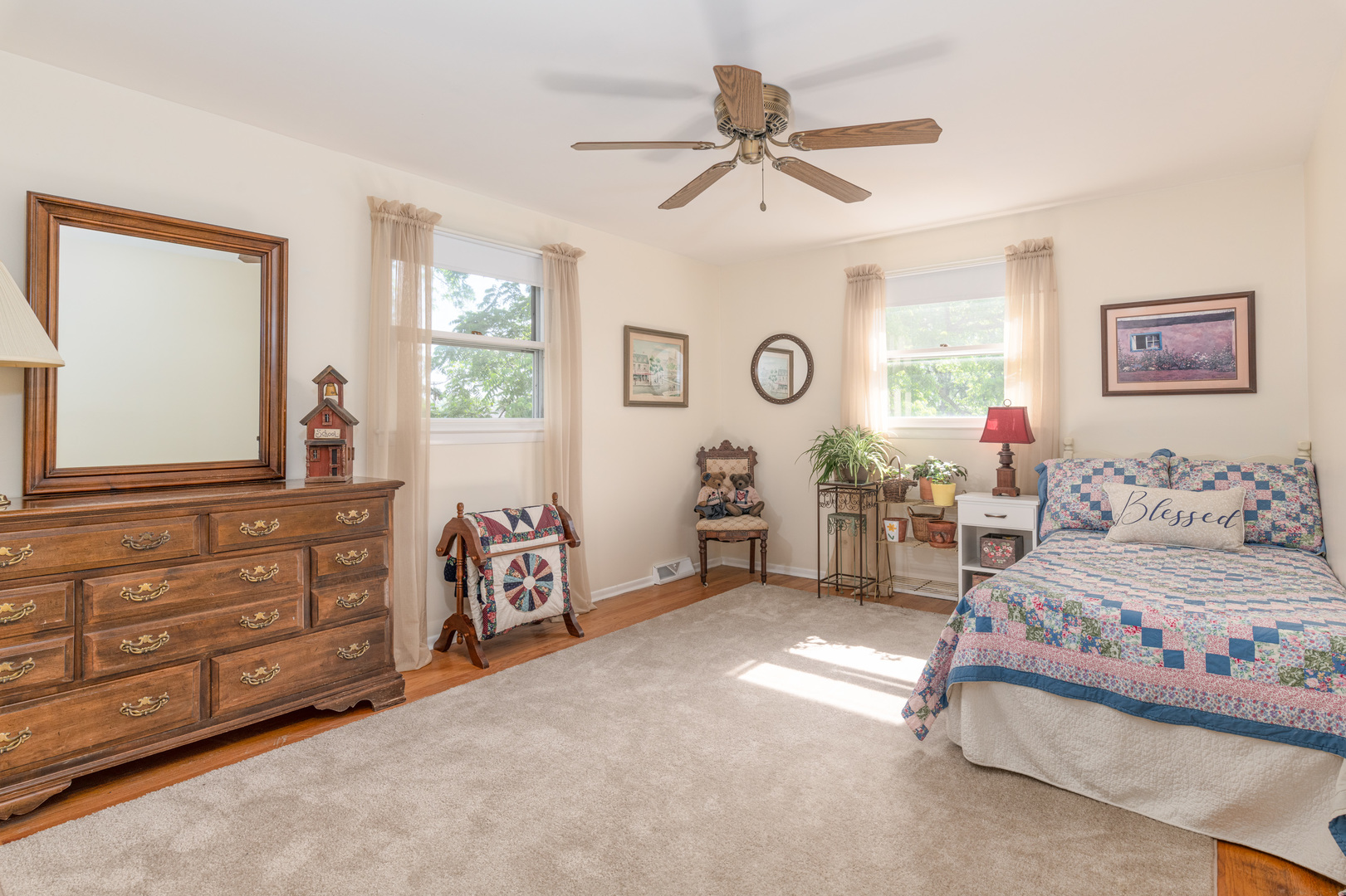 546 Northgate Road Lindenhurst, IL 60046 - Photo 13 of 26 a bedroom with a bed and a chandelier