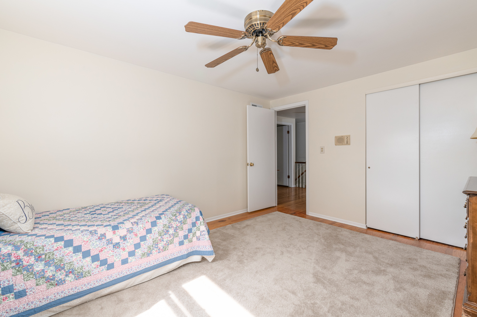 546 Northgate Road Lindenhurst, IL 60046 - Photo 14 of 26 a bedroom with a bed and a chandelier