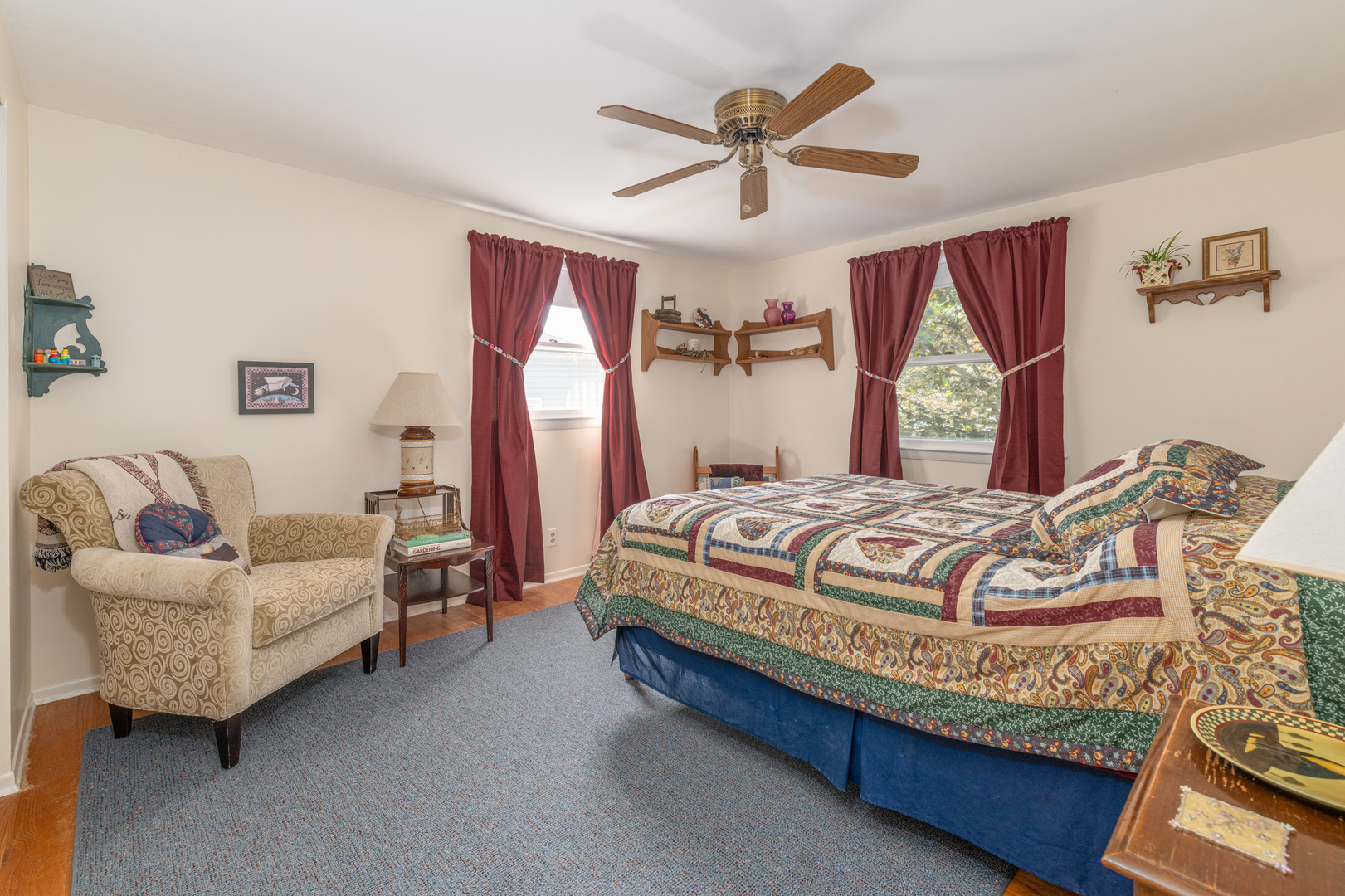 546 Northgate Road Lindenhurst, IL 60046 - Photo 15 of 26 a bedroom with a bed a couch and a chandelier
