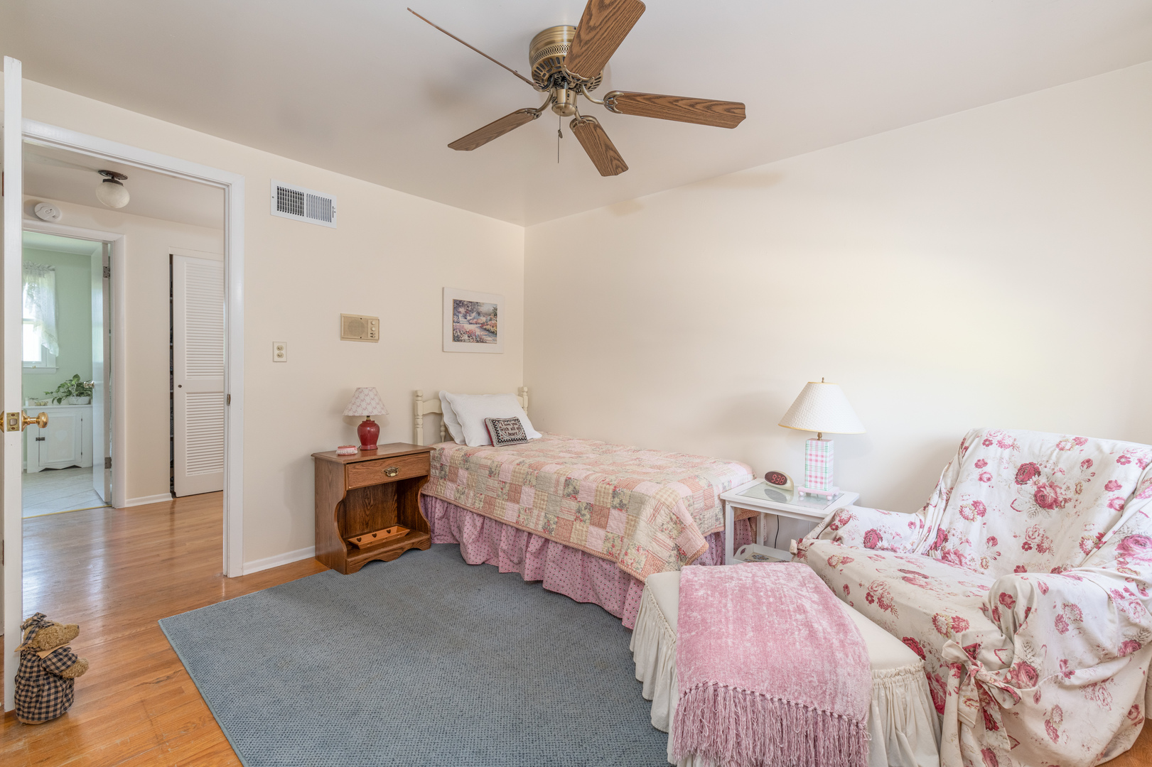 546 Northgate Road Lindenhurst, IL 60046 - Photo 18 of 26 a bedroom with two beds and a chandelier