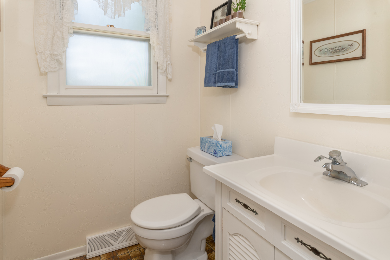 546 Northgate Road Lindenhurst, IL 60046 - Photo 21 of 26 a bathroom with a sink a toilet and a window