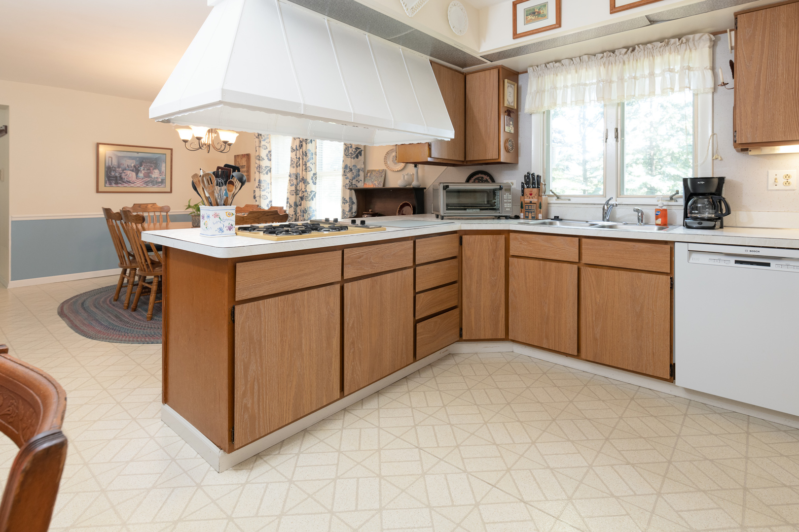 546 Northgate Road Lindenhurst, IL 60046 - Photo 5 of 26 a kitchen with a sink cabinets and window
