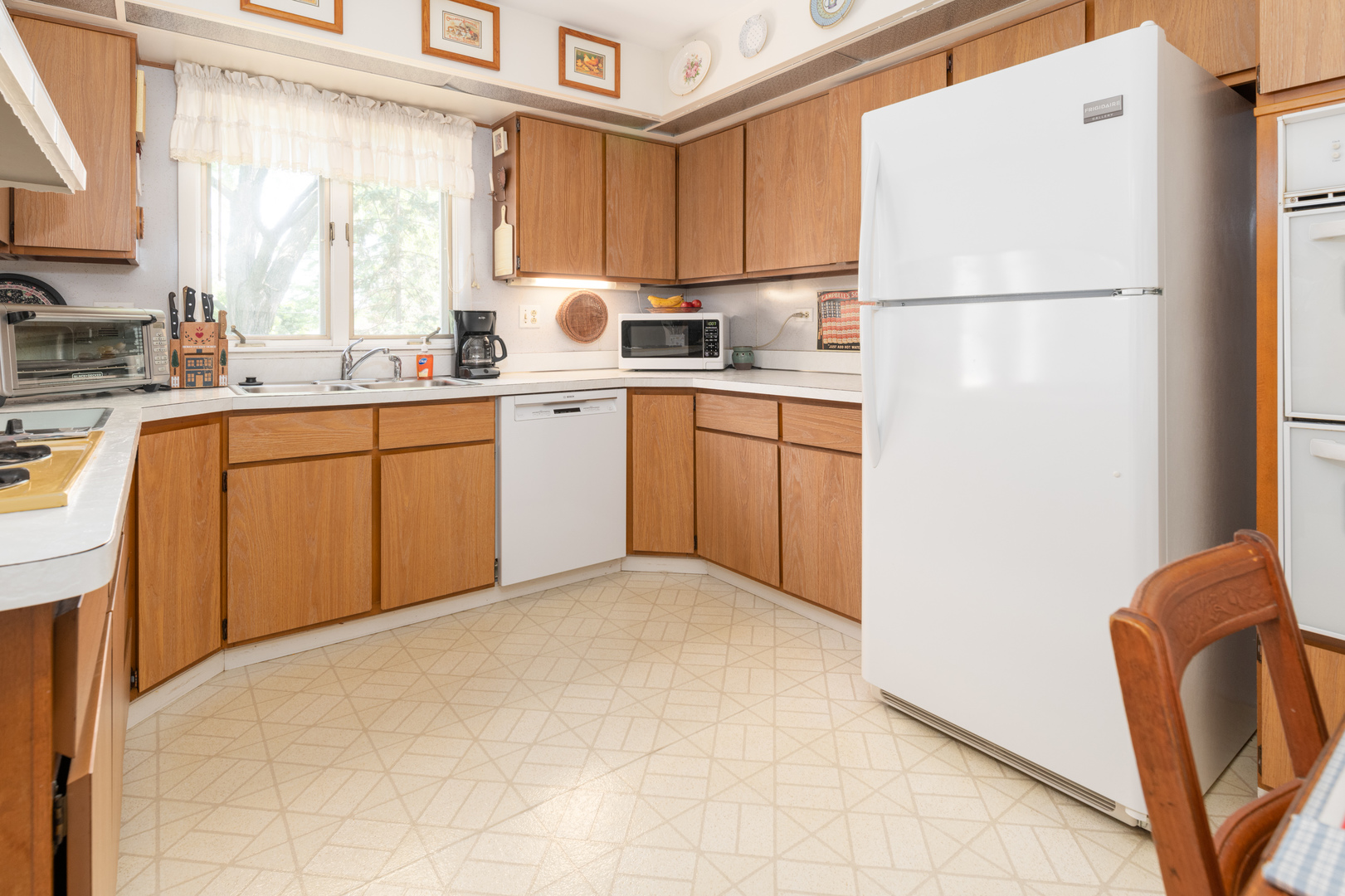 546 Northgate Road Lindenhurst, IL 60046 - Photo 6 of 26 a kitchen with stainless steel appliances granite countertop a refrigerator a sink a stove a microwave a counter top space and cabinets