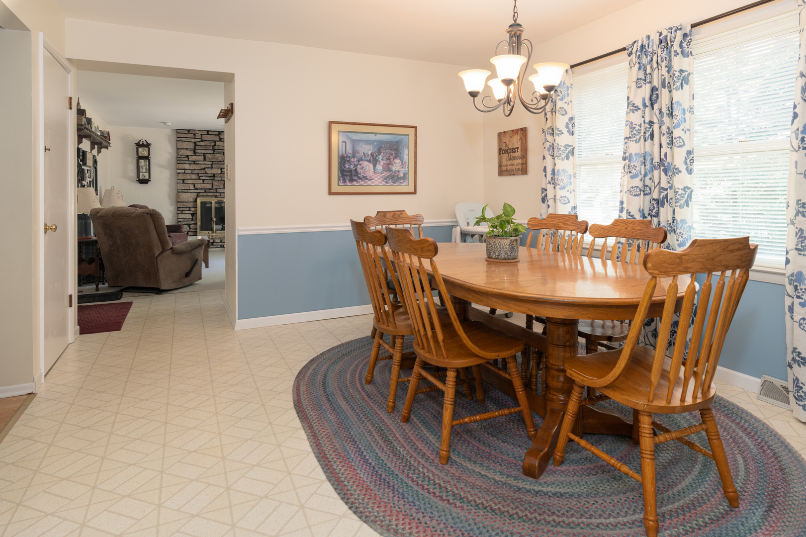 546 Northgate Road Lindenhurst, IL 60046 - Photo 7 of 26 a view of a dining room with furniture wooden floor and a chandelier
