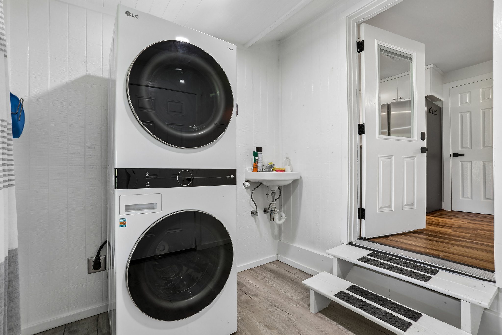 2089 Farm To Market Road 1704 Elgin, TX 78621 - Photo 22 of 31 A dedicated laundry room equipped with a stacked washer and dryer unit for ultimate convenience.
