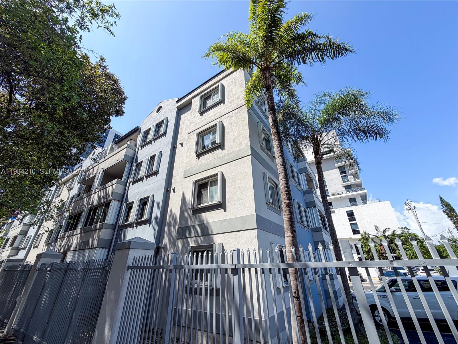 201 Northwest 7th Street, Unit 307 Miami, FL 33136 - Photo 20 of 22 a front view of a multi story building