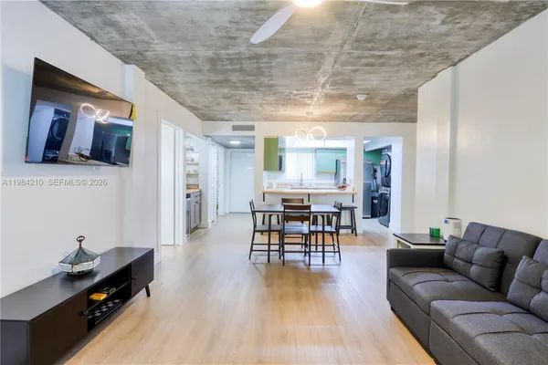 a kitchen with granite countertop a sink and cabinets
