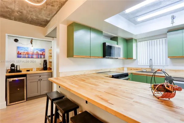 a kitchen with a sink and a microwave