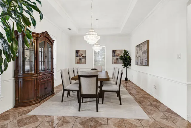 a view of a dining room with furniture and window