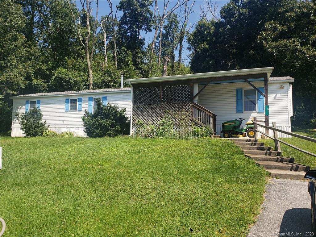 31 Finn Road Canterbury, CT 06331 - Photo 1 of 1 a view of backyard with potted plants and a large tree