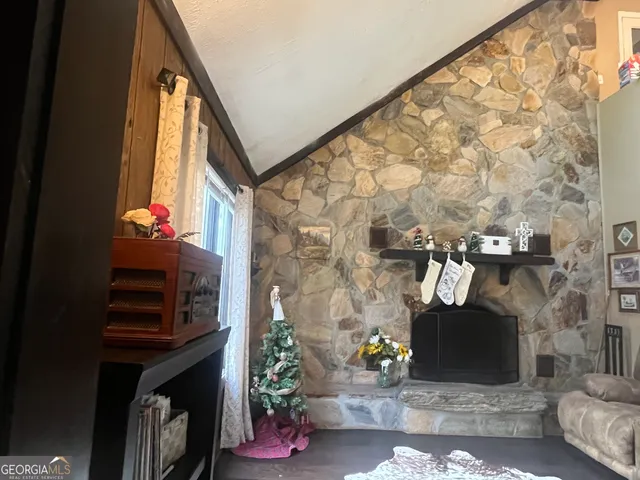 a living room with furniture and flowers