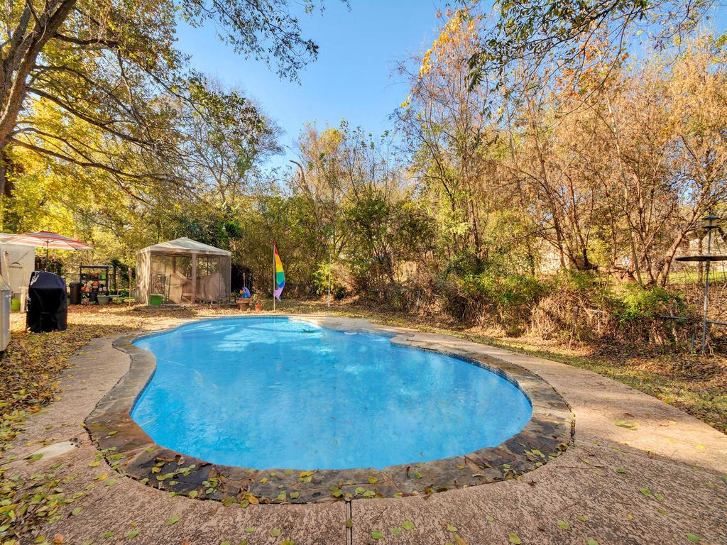 4500 Raleigh Circle Austin, TX 78744 - Photo 1 of 1 a view of a swimming pool with an outdoor space