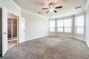 a bathroom with a tub a sink and a mirror