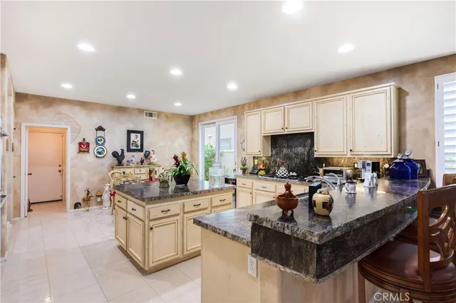 a kitchen with counter top space appliances and cabinets