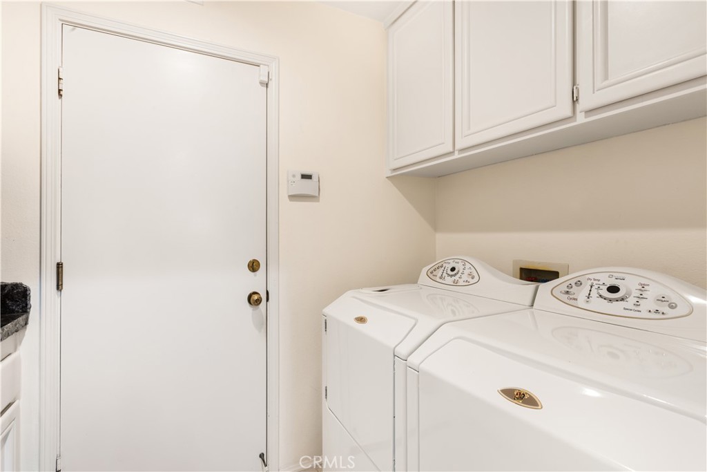 12665 Stanton Avenue Tustin, CA 92782 - Photo 16 of 52 a utility room with dryer and washer