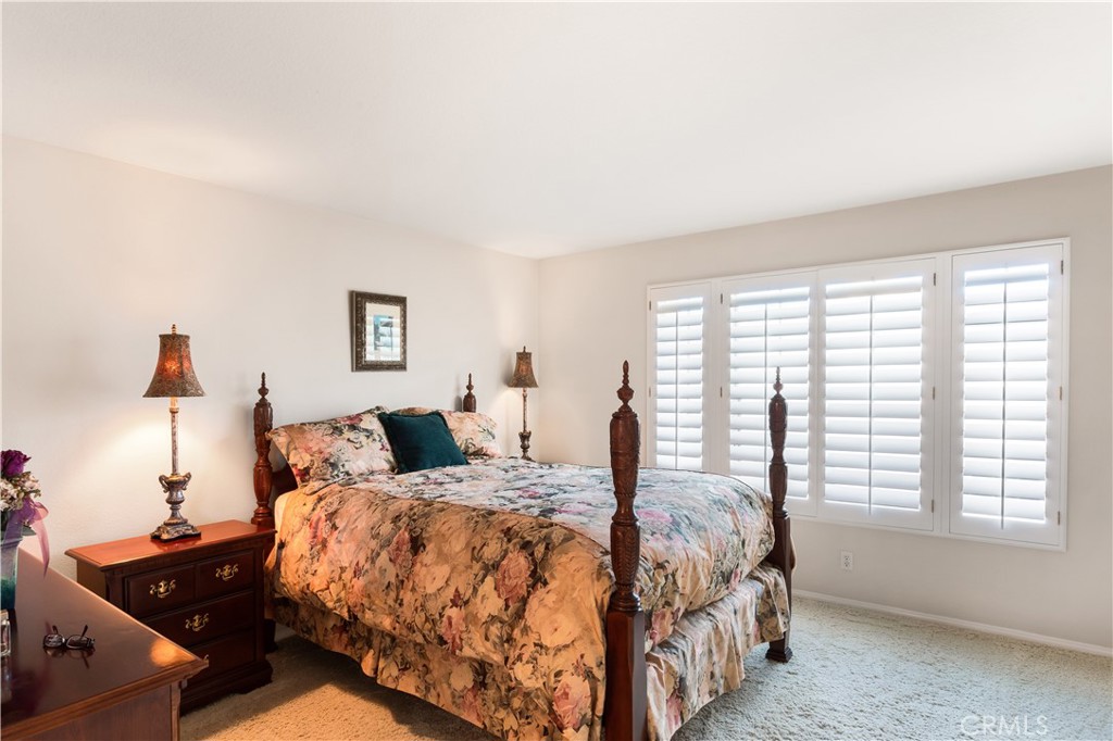 12665 Stanton Avenue Tustin, CA 92782 - Photo 19 of 52 a large bedroom with a bed and window