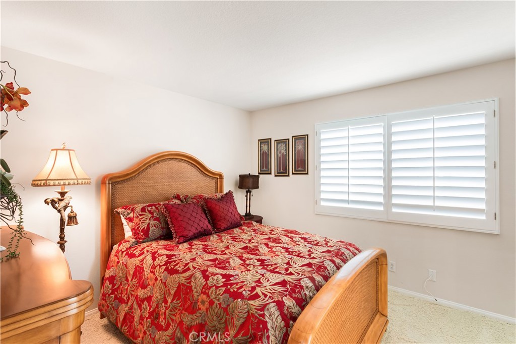 12665 Stanton Avenue Tustin, CA 92782 - Photo 26 of 52 a bedroom with a bed and a window