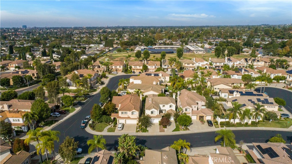 12665 Stanton Avenue Tustin, CA 92782 - Photo 51 of 52 an aerial view of residential houses with outdoor space