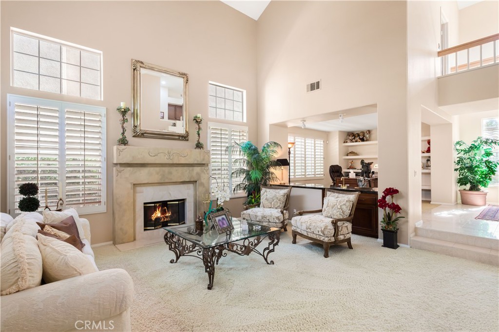 12665 Stanton Avenue Tustin, CA 92782 - Photo 6 of 52 a living room with furniture and a fireplace