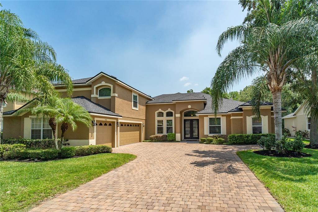 4961 Parkview Drive St. Cloud, FL 34771 - Photo 1 of 1 a front view of a house with a garden