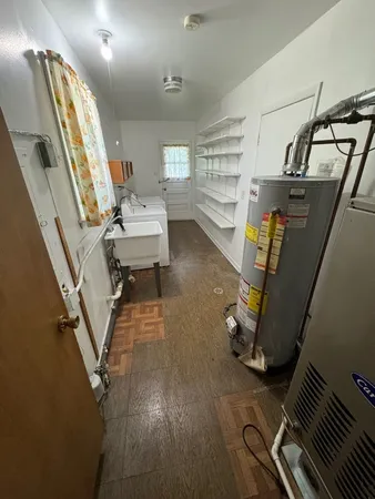 a room with stainless steel appliances washer and dryer