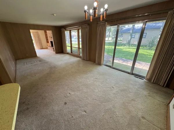 a view of a kitchen with a sink and cabinets