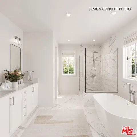 a bathroom with a bathtub sink and mirror